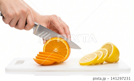 Person slicing fresh citrus fruits with a stainless steel kitchen knife on a white cutting board preparation culinary vegetarian ingredient background nutrition refreshing tropical textured 141297231