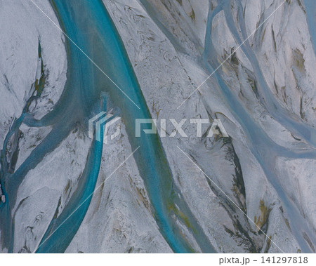 Aerial view of vibrant braided glacial rivers winding through Jokulsasandur, Lon, east Iceland. 141297818