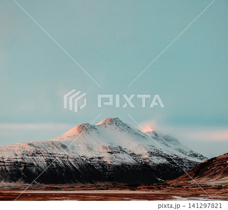 Snow-capped Hoffelsfjall mountain bathed in soft light, Hornafjordur, Iceland. Snow-capped Hoffelsfjall mountain bathed in soft light, Hornafjordur, Iceland. 141297821