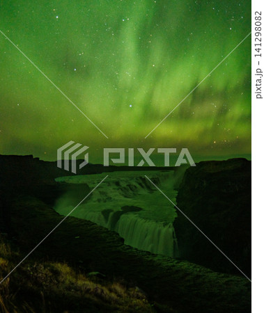 Northern lights over Gullfoss waterfall in south Iceland, a magical night view Northern lights over Gullfoss waterfall in south Iceland, a magical night view 141298082