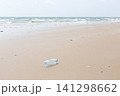 Empty Used Plastic Bottle on Remote Deserted Sea Sand Tropical Beach 141298662