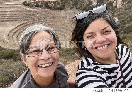 Women posing at Moray Inca agricultural ruins. UGC 141299109