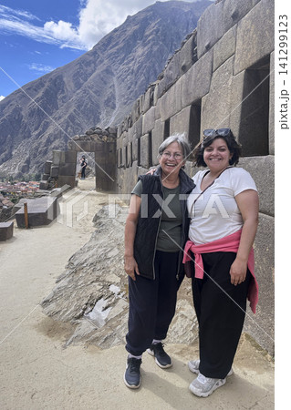 Family posing at ancient Inca Temple ruins 141299123