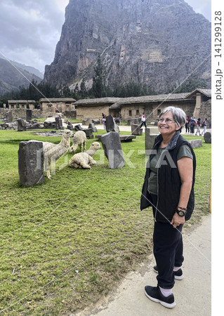 Senior woman and daughter with alpacas in Peru. UGC 141299128
