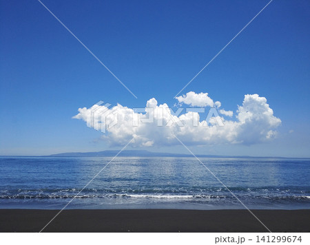 Ocean waves on a deserted beach with black volcanic sand. Ocean waves on a deserted beach with black volcanic sand. 141299674