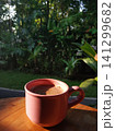 A mug of tea on a beautiful tropical background of rice fields 141299682