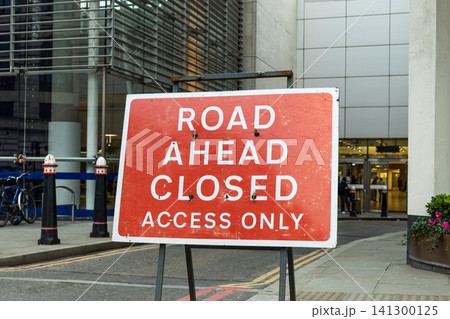 Road ahead closed access only sign on city street Road ahead closed access only sign on city street 141300125