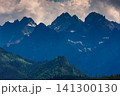 Sunlit green mountain valley with meadow, forested slopes in Zakopane Tatras mountains 141300130