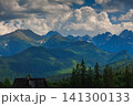 Sunlit green mountain valley with meadow, forested slopes in Zakopane Tatras mountains 141300133