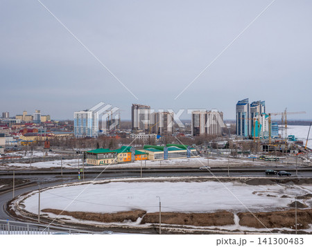 March 22 2026 Barnaul Russia aerial view of Bavarin Square and River Station covered in snow cold early spring cityscape urban architecture and winter atmosphere. March 22 2026 Barnaul Russia aerial view of Bavarin Square and River Station covered in snow cold early spring cityscape urban architecture and winter atmosphere. 141300483