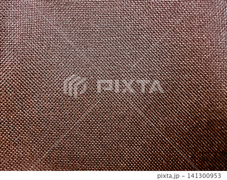 detailed macro view of coarse copper woven textile grid texture serving as rustic abstract background for packaging and web design 141300953