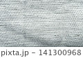 detailed macro view of coarse white woven linen texture for sustainable packaging 141300968
