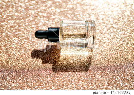 Skincare serum dropper bottle on glitter background Skincare serum dropper bottle on glitter background 141302287