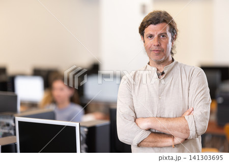 Portrait of a successful young female student in university computer class 141303695