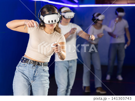 Girl playing active video games Girl playing active video games 141303743