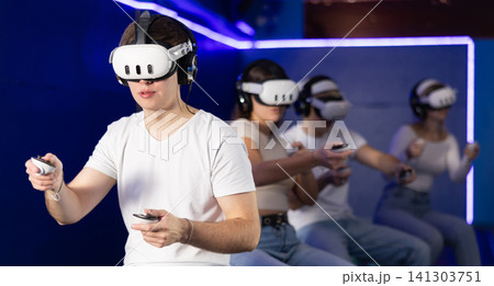 Guy in vr glasses playing with friends 141303751