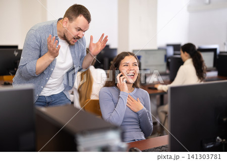 Teacher unhappy with girl loud phone conversation - calls for silence during university exam Teacher unhappy with girl loud phone conversation - calls for silence during university exam 141303781