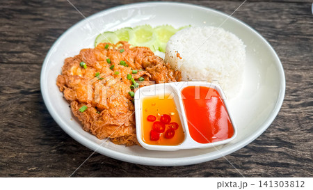 Crab omelet with rice on the wood table Crab omelet with rice on the wood table 141303812