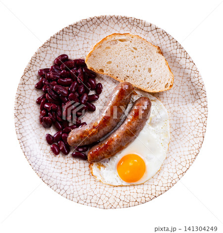 Portion of breakfast food is fried egg and pork sausage with stewed beans Portion of breakfast food is fried egg and pork sausage with stewed beans 141304249