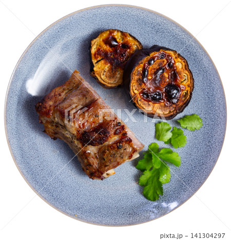 Delicious pork ribs with stewed eggplant on plate Delicious pork ribs with stewed eggplant on plate 141304297