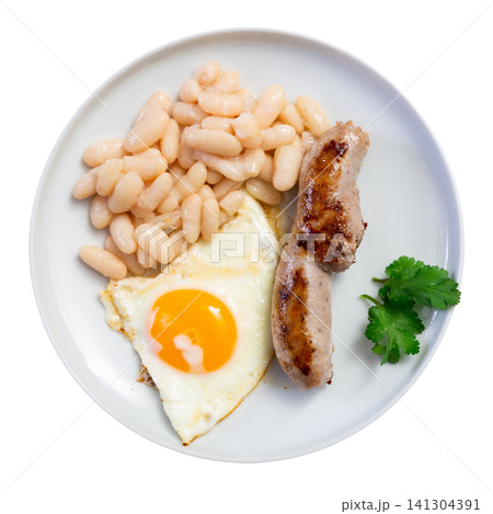 Portion of breakfast food is fried egg and pork sausage with stewed beans Portion of breakfast food is fried egg and pork sausage with stewed beans 141304391