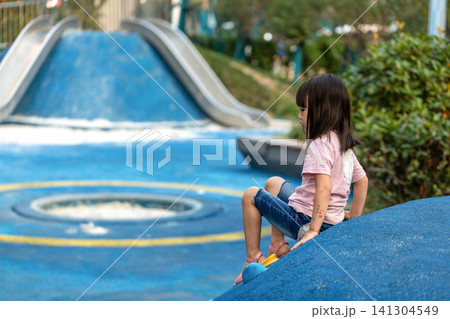 Asian Little Girl Climbing Wall at Outdoor Playground Asian Little Girl Climbing Wall at Outdoor Playground 141304549