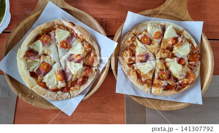 pizza on wooden background pizza on wooden background 141307792