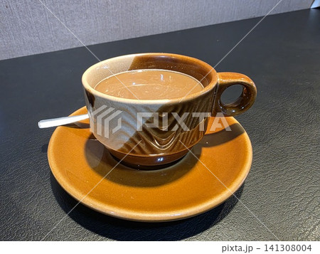 hot coffee on a saucer 141308004
