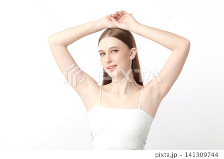 Beautiful Young Asian woman Raises her hands to Showcase clean and hygienic underarms Against a white background, Smooth armpit cleanliness and protection concept Beautiful Young Asian woman Raises her hands to Showcase clean and hygienic underarms Against a white background, Smooth armpit cleanliness and protection concept 141309744