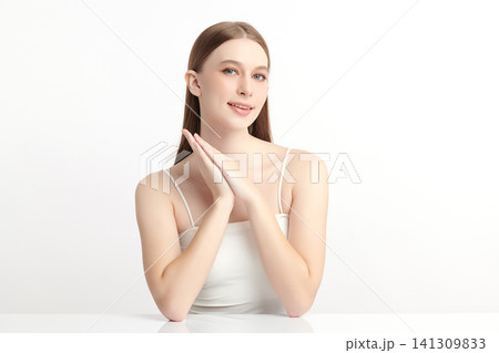A beautiful young Asian woman with clean, fresh skin against a white background. Skincare, facial treatment, cosmetology, beauty, and spa. An elegant portrait of an Asian woman. A beautiful young Asian woman with clean, fresh skin against a white background. Skincare, facial treatment, cosmetology, beauty, and spa. An elegant portrait of an Asian woman. 141309833