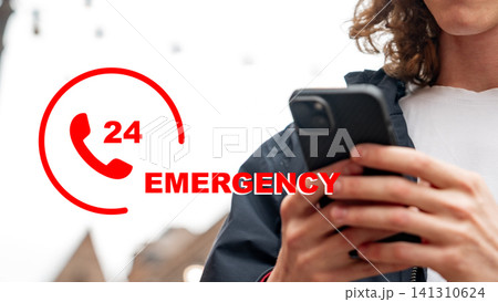 Calling emergency services from a mobile phone in a busy city street Calling emergency services from a mobile phone in a busy city street 141310624