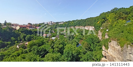 Panoramic view of the spectacular Smotrych River canyon in Kamianets-Podilskyi Panoramic view of the spectacular Smotrych River canyon in Kamianets-Podilskyi 141311443
