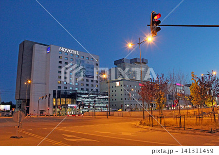Novotel hotel building and city street at night in Lodz Poland Novotel hotel building and city street at night in Lodz Poland 141311459