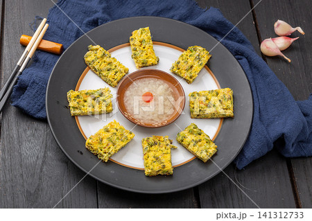 chinese traditional pan-fried locust flower pancake, round savory pastry. chinese traditional pan-fried locust flower pancake, round savory pastry. 141312733
