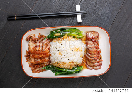 traditional Chinese combo rice with braised pork belly and sweet BBQ pork char siu. traditional Chinese combo rice with braised pork belly and sweet BBQ pork char siu. 141312756