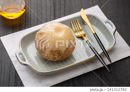 traditional Hainan coconut rice, sweet sticky glutinous rice steamed inside a whole coconut shell traditional Hainan coconut rice, sweet sticky glutinous rice steamed inside a whole coconut shell 141312782