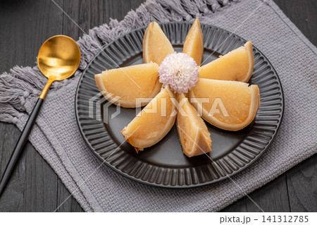 traditional Hainan coconut rice, sweet sticky glutinous rice steamed inside a whole coconut shell, sliced and served as a tropical dessert. traditional Hainan coconut rice, sweet sticky glutinous rice steamed inside a whole coconut shell, sliced and served as a tropical dessert. 141312785