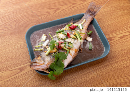 cantonese style steamed sea bass with scallions, ginger and soy sauce cantonese style steamed sea bass with scallions, ginger and soy sauce 141315136