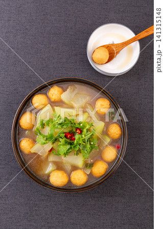 simmered winter melon soup with golden fried fish balls and cilantro simmered winter melon soup with golden fried fish balls and cilantro 141315148