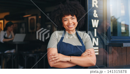 Happy black woman, cafe and owner by door of small business in confidence for management. Portrait of young African female person or waitress smile with arms crossed of professional at coffee shop Happy black woman, cafe and owner by door of small business in confidence for management. Portrait of young African female person or waitress smile with arms crossed of professional at coffee shop 141315878