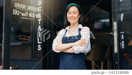 Happy asian woman, cafe and owner by door of small business in confidence for management. Portrait of young female person or waitress smile with arms crossed by professional restaurant or coffee shop Happy asian woman, cafe and owner by door of small business in confidence for management. Portrait of young female person or waitress smile with arms crossed by professional restaurant or coffee shop 141316090