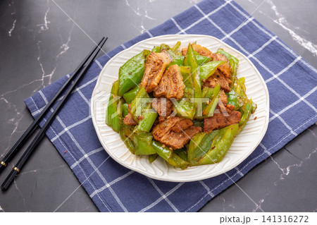 classic Chinese Stir Fried Sliced Pork with Green Bell Peppers and Savory Sauce classic Chinese Stir Fried Sliced Pork with Green Bell Peppers and Savory Sauce 141316272