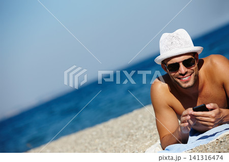 Man, beach and smartphone in portrait on holiday with ocean on seashore with blue sky in summer for peace. Male person, vacation and relax with phone for memories in cancun with wellness on trip Man, beach and smartphone in portrait on holiday with ocean on seashore with blue sky in summer for peace. Male person, vacation and relax with phone for memories in cancun with wellness on trip 141316474
