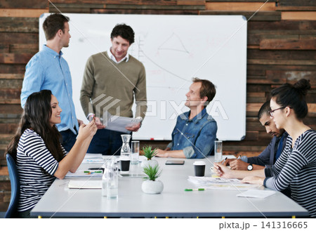 Creative people, documents and meeting with team for startup, collaboration or planning in boardroom office. Group of happy employees in discussion with paperwork for brainstorming ideas at workplace Creative people, documents and meeting with team for startup, collaboration or planning in boardroom office. Group of happy employees in discussion with paperwork for brainstorming ideas at workplace 141316665