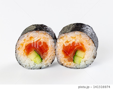Sushi roll cross section with salmon and cucumber on white background 141316974