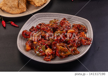 Spicy stir fried meat with peppers and onions on ceramic plate Spicy stir fried meat with peppers and onions on ceramic plate 141317190