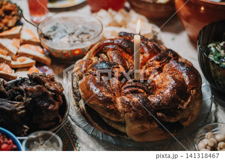 Traditional Christmas bun with poppy seeds and candle.  141318467
