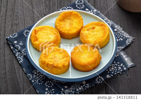 pan fried coarse grain corn cakes with golden crispy crust 141318811