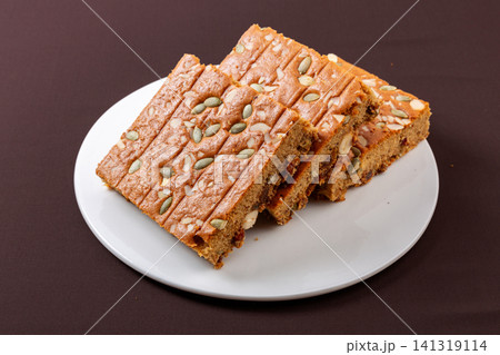 sliced jujube brown sugar cake topped with mixed nuts and seeds sliced jujube brown sugar cake topped with mixed nuts and seeds 141319114