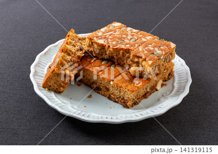 sliced jujube brown sugar cake topped with mixed nuts and seeds sliced jujube brown sugar cake topped with mixed nuts and seeds 141319115